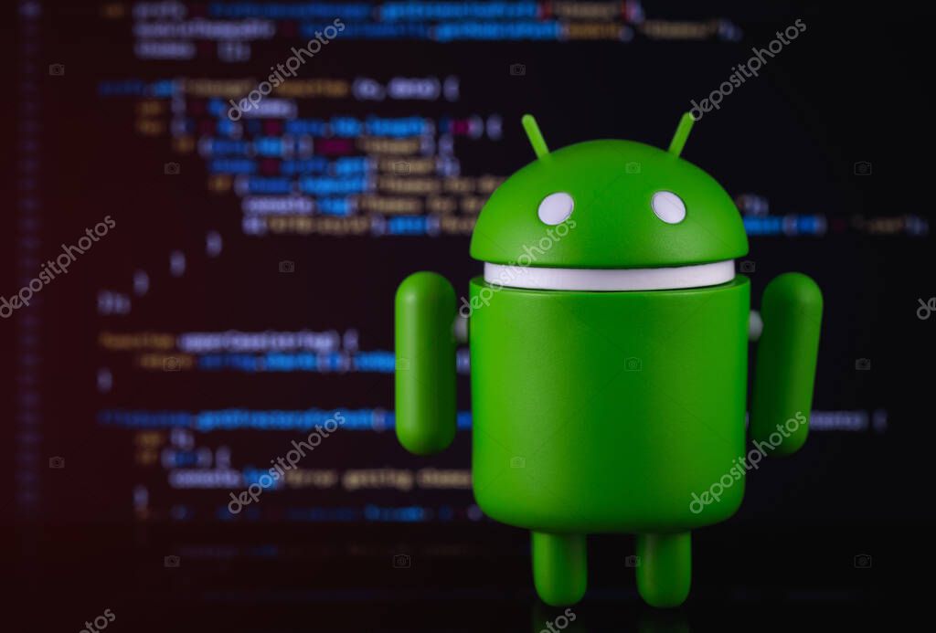 Google Android figure on blurred digital background. Google Android is the operating system for smartphones, tablet computers, e-books, game consoles, and other devices. Moscow, Russia - March 18, 2019
