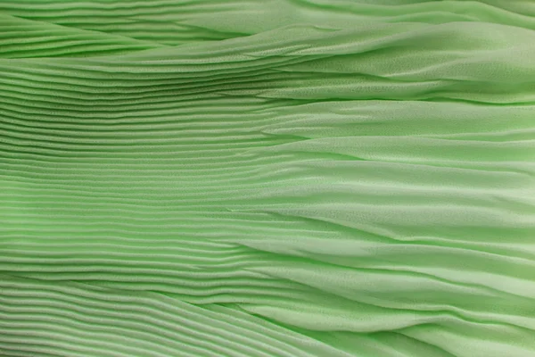 Pleated fabric background texture. pattern of fabric in the crea