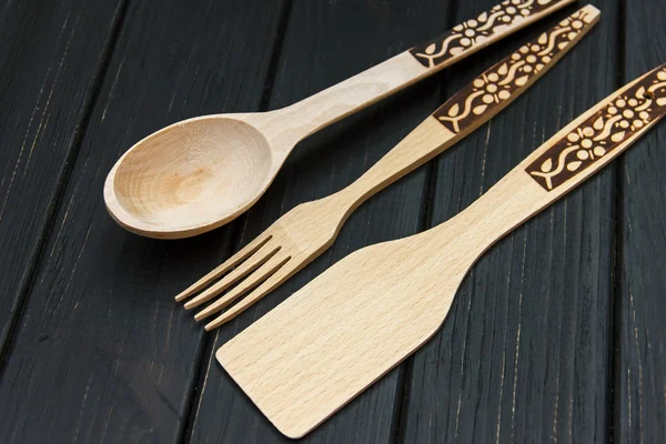 Wooden spoons utensils wood kitchen utensils lying — Stockfoto