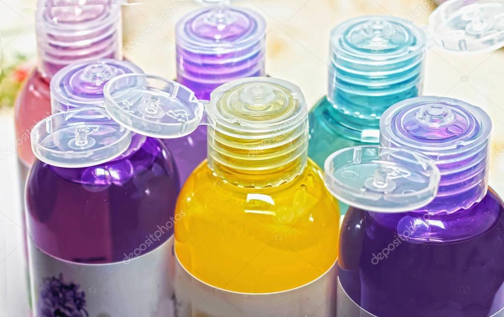 colored bottles for cosmetics, cosmetics and shampoos,  