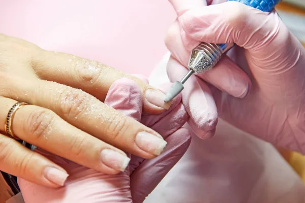 correction and nail extensions,  in a beauty salon