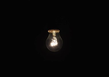 light bulb shines a bright light, soft focus clipart
