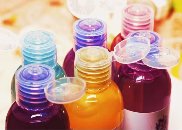 Colored bottles for cosmetics, cosmetics and shampoos, — Stock Photo, Image