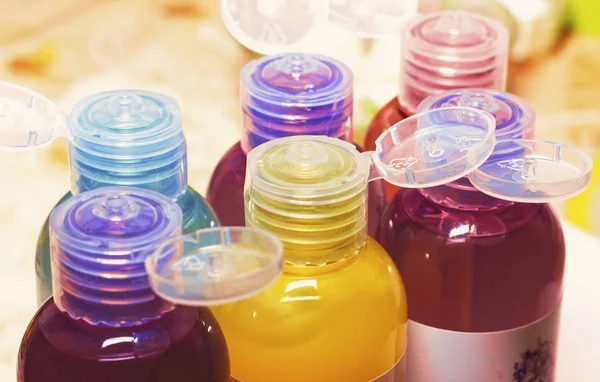 colored bottles for cosmetics, cosmetics and shampoos,