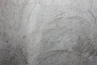 gri doku duvar üzerinde çizik sıva ile,