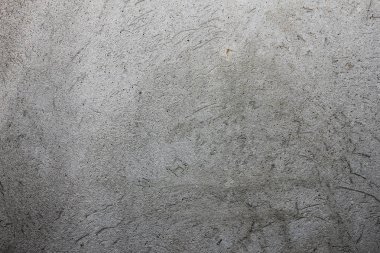 gri doku duvar üzerinde çizik sıva ile,