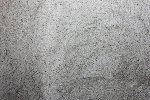 gri doku duvar üzerinde çizik sıva ile,