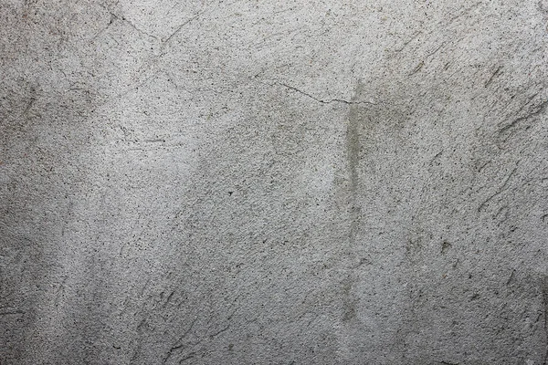 gri doku duvar üzerinde çizik sıva ile,