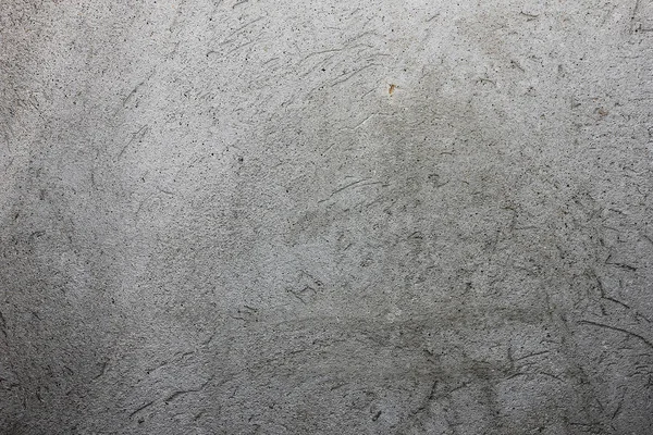 gri doku duvar üzerinde çizik sıva ile,