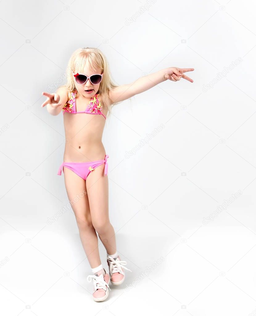 Beautiful teen girl dancing dressed in swimsuit,  