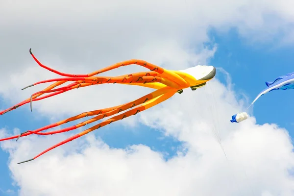 Bright kites floating in the blue sky, kite festival, air — Stock Photo, Image