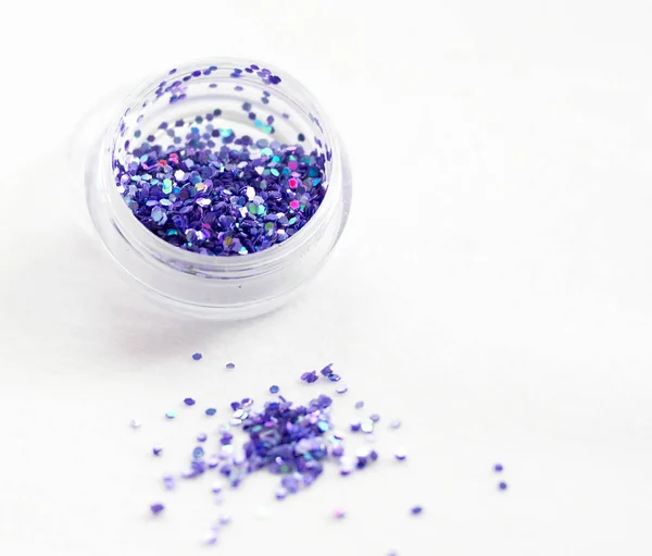 Glitter and sequins for nail design and makeup. decorations for — Stock Photo, Image