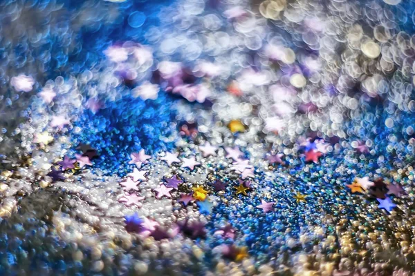 candies, sparkles and sparkling dust, texture of a bright blurre