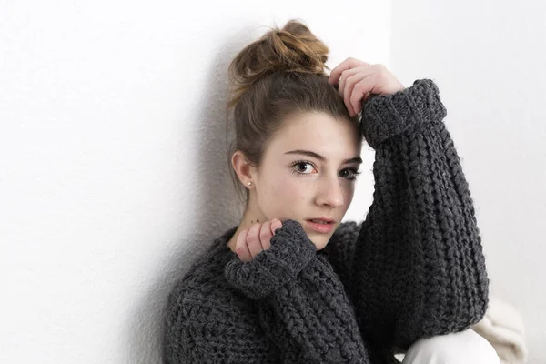 stock image Young woman with serious face on a white background. 