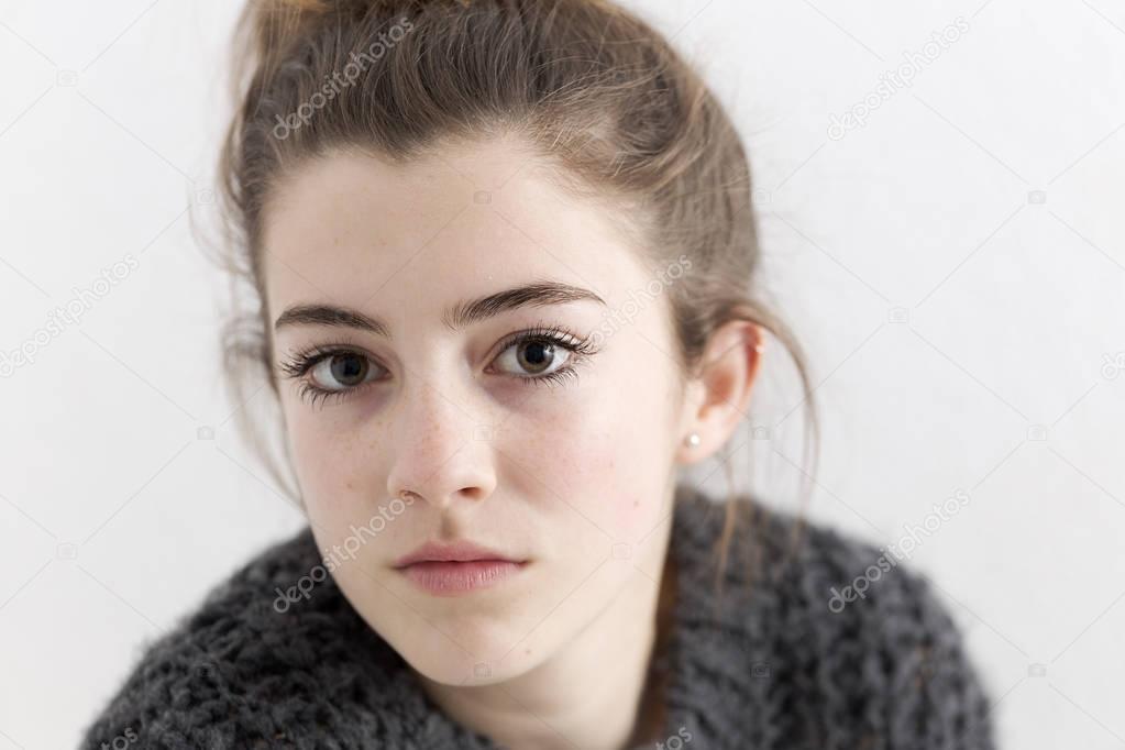 Close-up of young woman with serious face