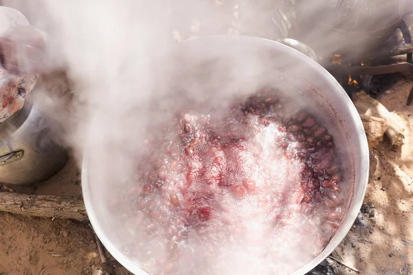 Food preparation in the wood fire. Shot made in M\'Hamid El Ghizlane, a small oasis town in the province of Zagora Dra-Tafilalet, in Morocco.