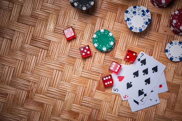 Poker Chips in casino gamble green table.