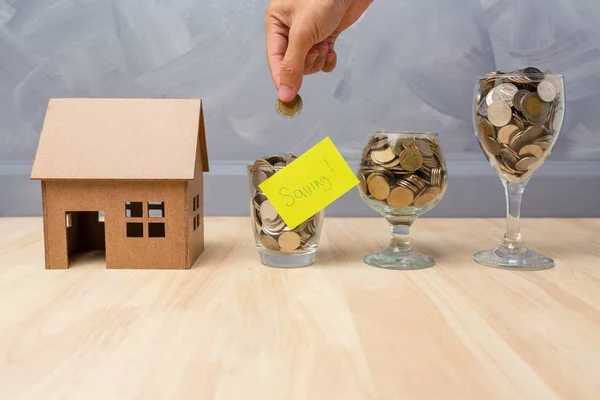 Saving money in the glasses bottle for buy a house real estate c