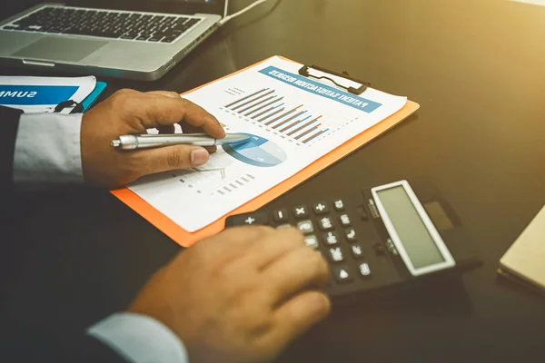 Business man working alone in the office with accounting documen