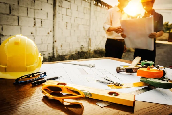 A desk of engineers who are studying the area for laying foundat — Stock Photo, Image