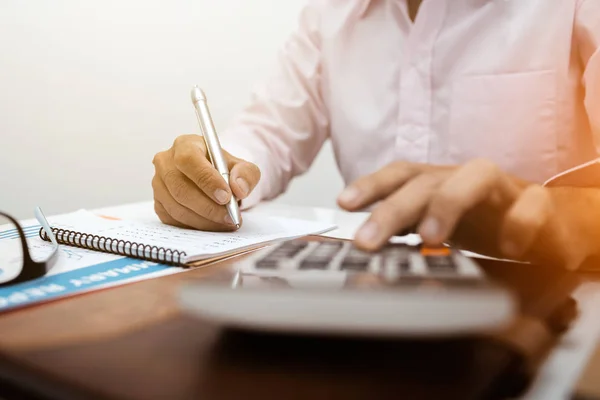 Business man accountant using calculator to calculating bugget — Stock Photo, Image