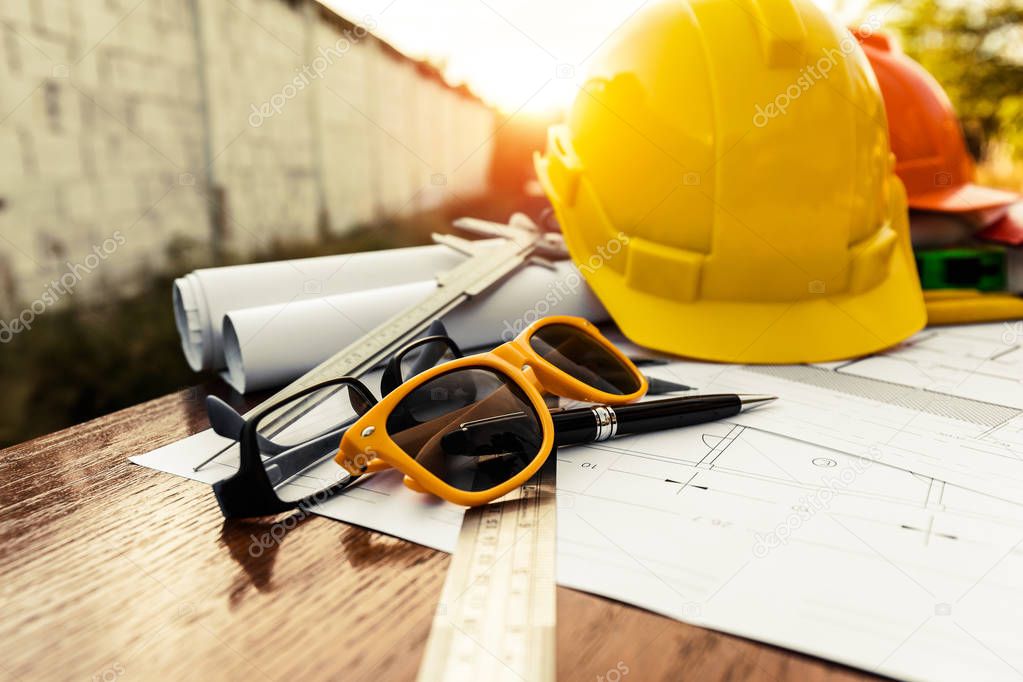 A desk of contractor engineers who are going to build a low cost home and save energy.