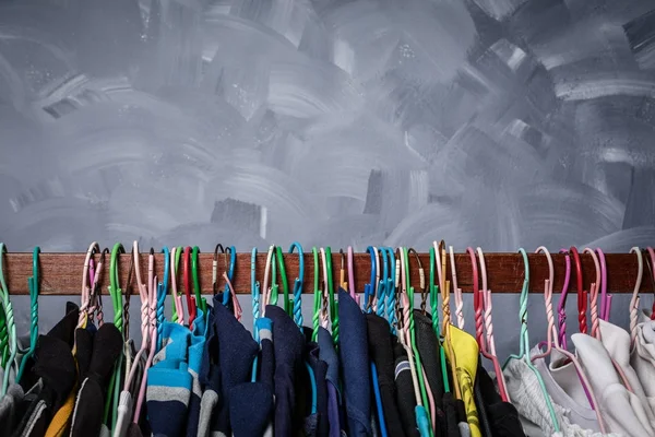 Clothes rack clothes were hanging by a variety of colors for men older Asians.