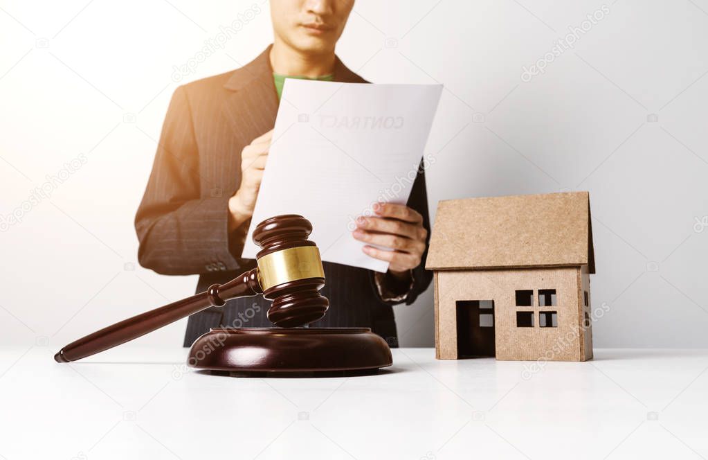 Real estate insurance lawyer working hard.