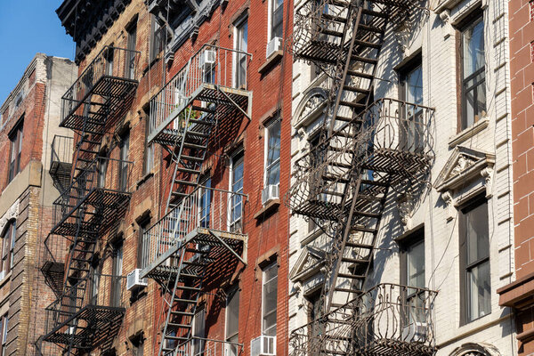 New York, United States of America - September 22, 2019: Residential Buildings with typical fire escapes in Manhatten.