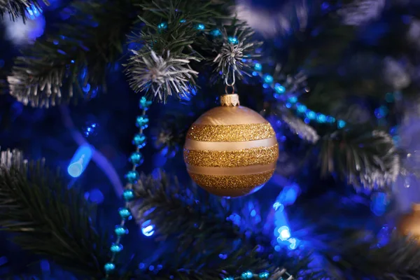 Christmas tree background with golden ball. — Stock Photo, Image
