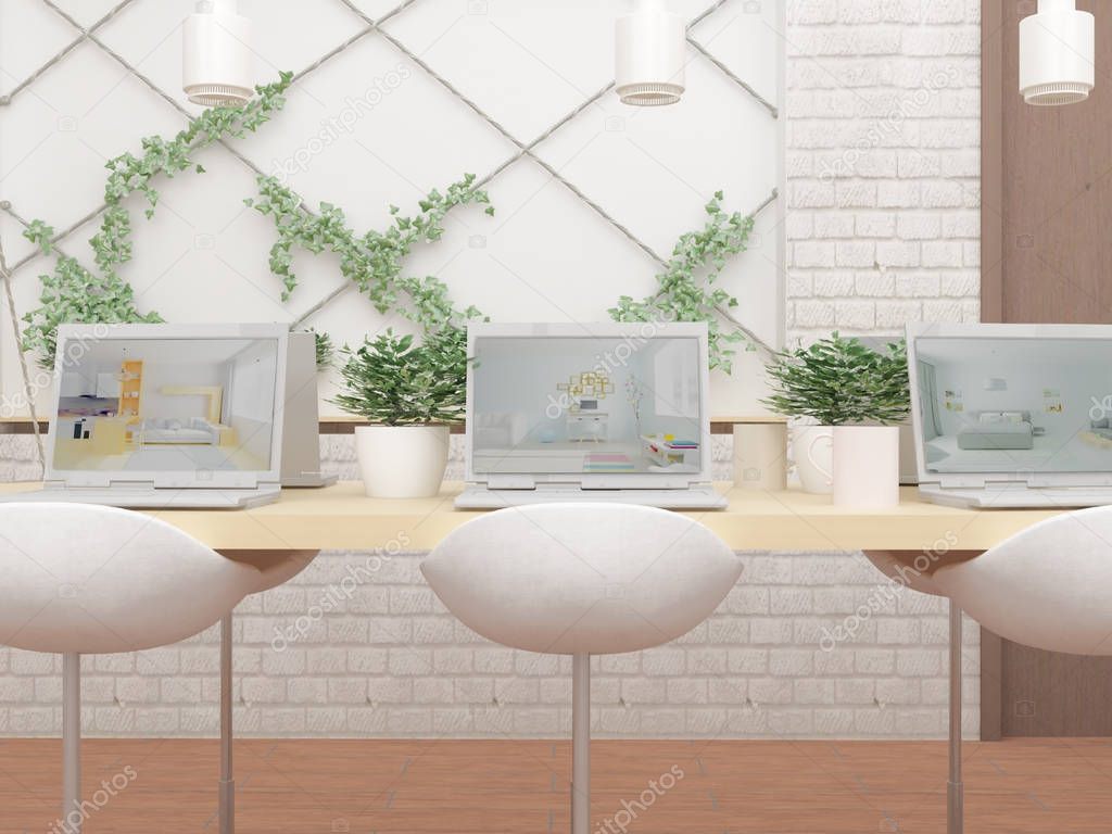 computers on table, green plants and chairs