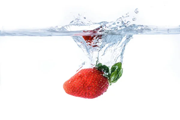 Strawberry splashing into crystal water — Stock Photo, Image