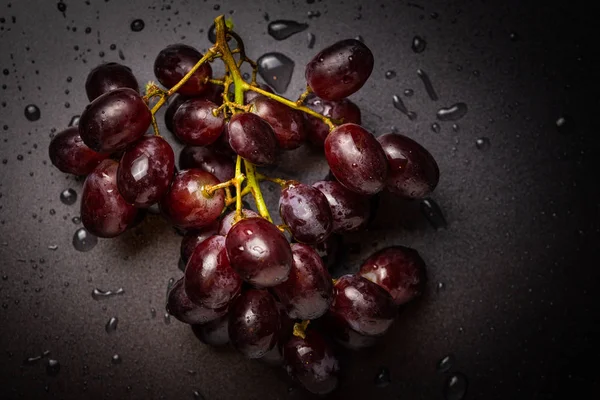 Close up of red grapes on black background with copy space. — Stock Fotó