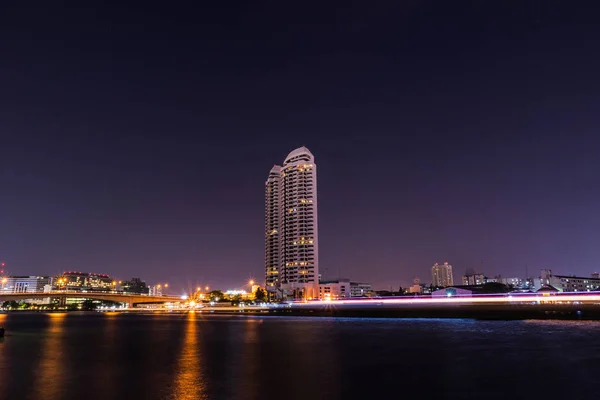 Waterfront Building Chao Phraya River at night — Stock Photo, Image