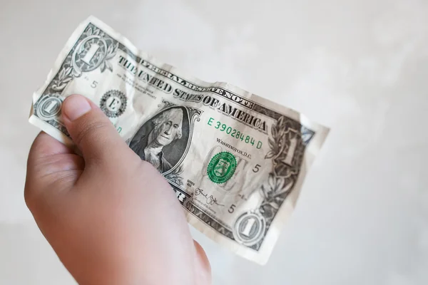 Male hand hold one dollar bill in giving gesture — Stock Photo, Image