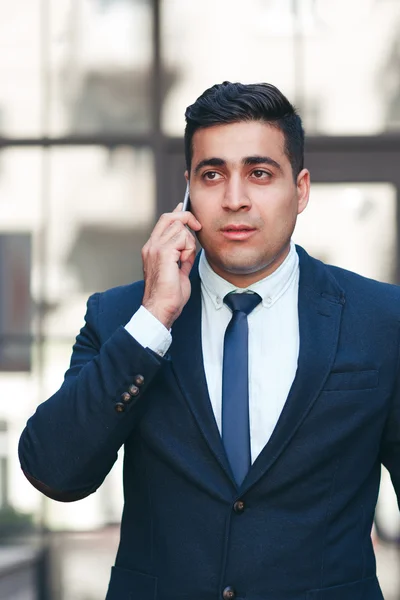 Young man talking on the mobile phone