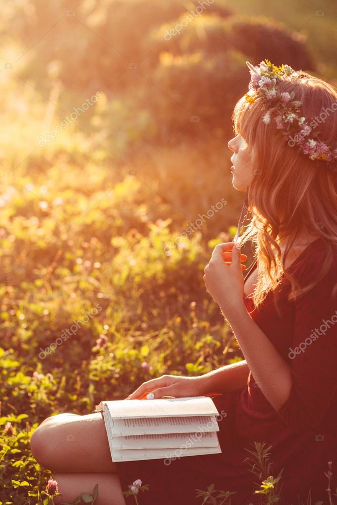 Profile Of Girl In Wreath With Book Sun Flare Stock Photo