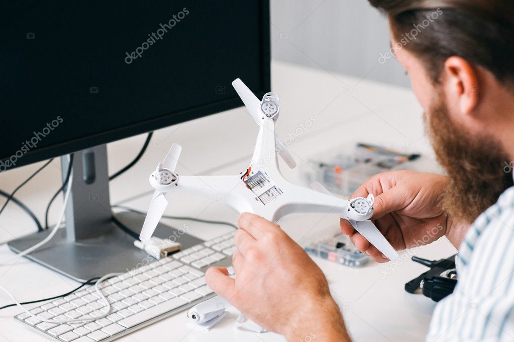 Drone testing in toy repair shop Stock Photo by ©golubovy 128766238
