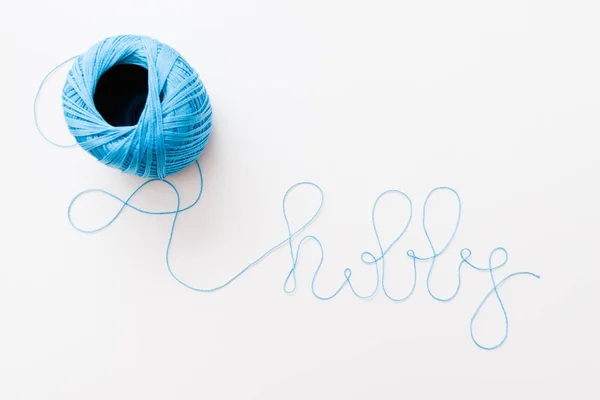 Word hobby of blue thread on white, free space — Stock Photo, Image