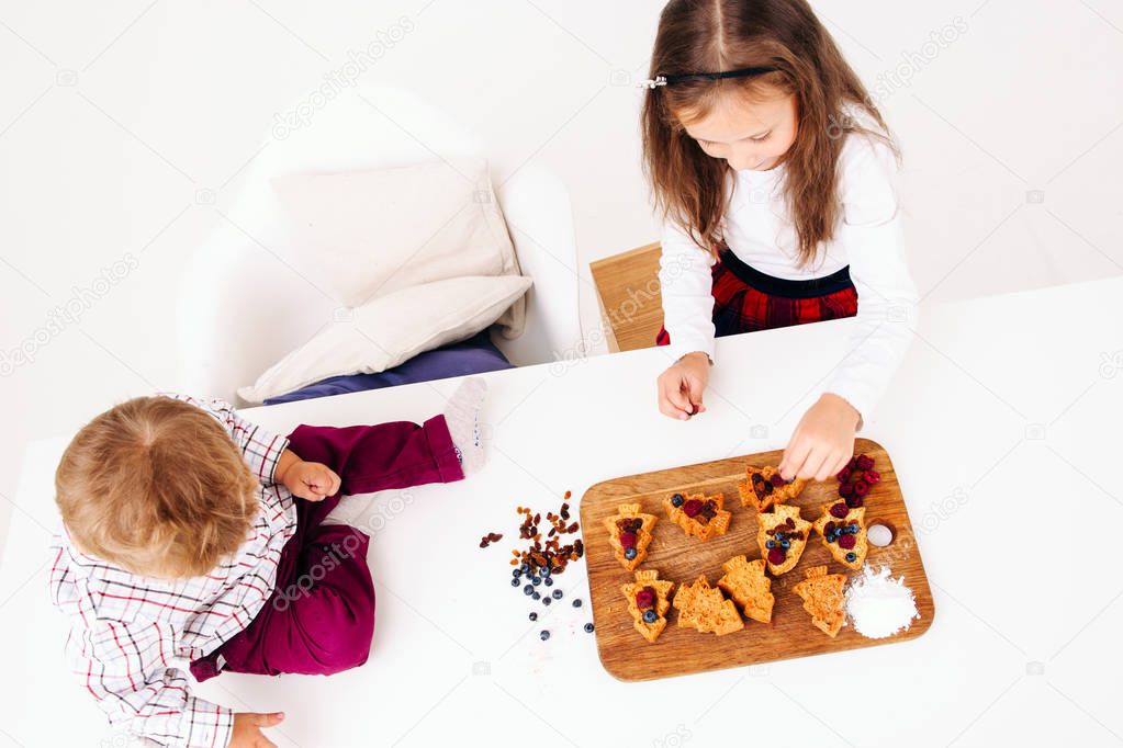 Children cooking pastry, top view, free space