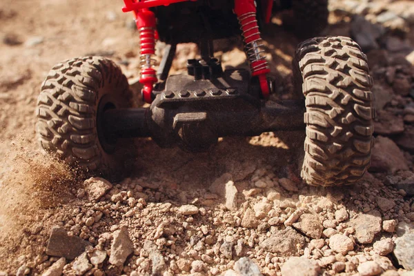 Toy car skidding on dry landscape, close-up — Stock Photo, Image