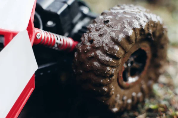 Muddy wheels of toy car close-up — Stock Photo, Image