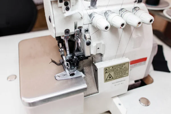 Overlock sewing machine in tailor office close-up — Stock Photo, Image