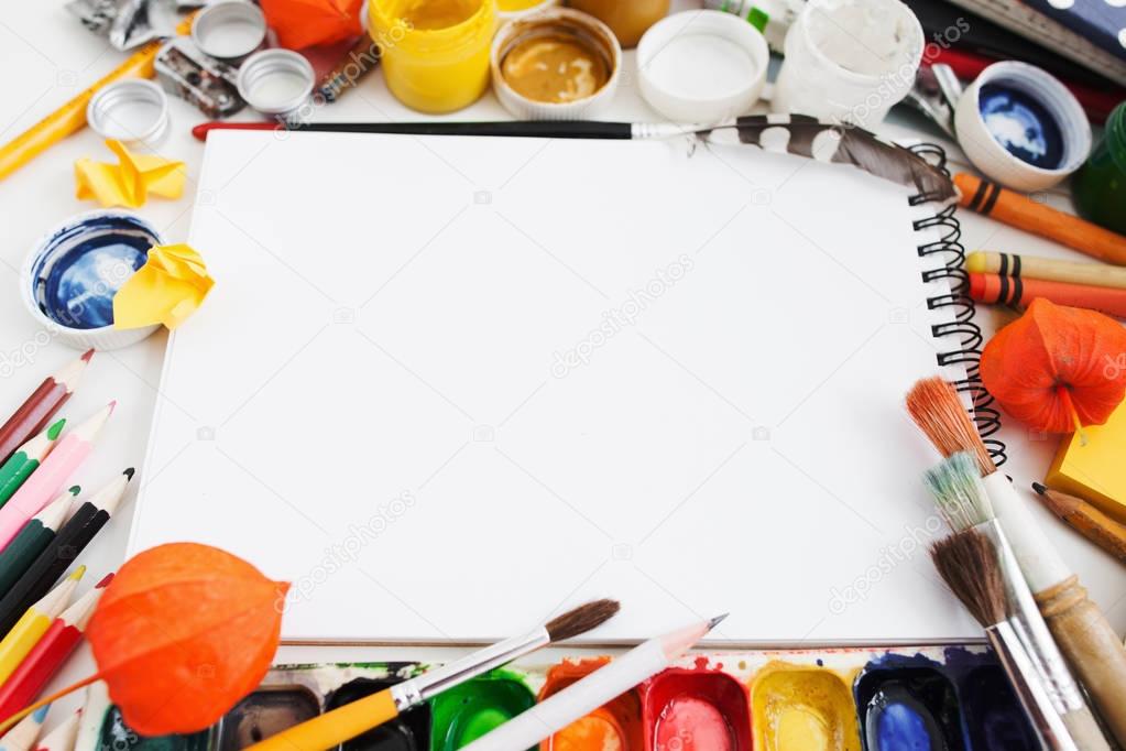 Colorful drawing tools frame for blank sketchbook