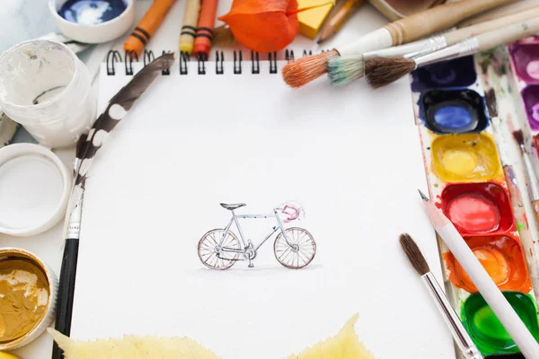 Pretty pictured bicycle with drawing supplies