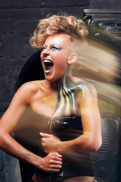 Portrait of screaming punk woman long exposure