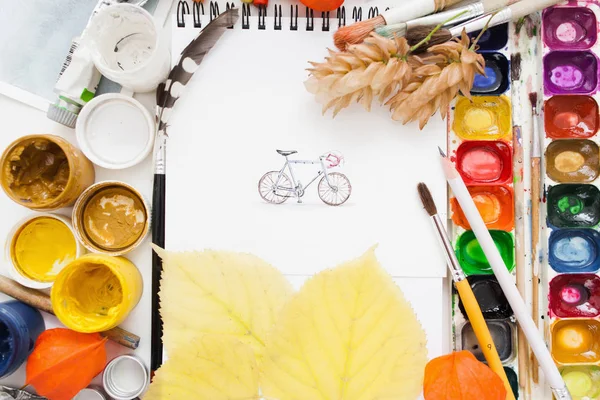 Pretty pictured bicycle on artist work flat lay — Stock Photo, Image