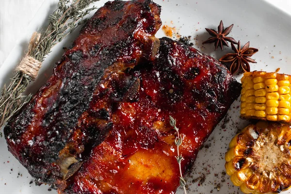 Hot bbq ribs served with corn flat lay — Stock Photo, Image