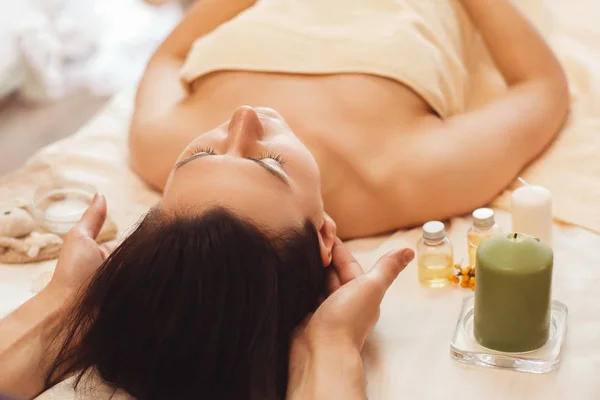 Woman with migraine relaxing at salon free space