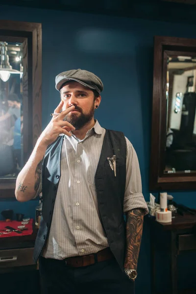 Young man smoking indoor free space